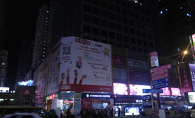 Outdoor billboard spot lights at CMB Wing Lung Bank Centre in Mong Kok before & after the event.